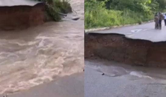 Chuva forte rompe asfalto, isola o cemitério e abre cratera na Estrada de Santo Antônio em Porto Velho (RO)