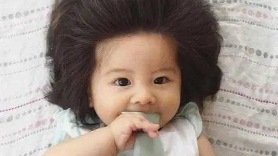Nova bebê cabeluda conquista a web; fotos